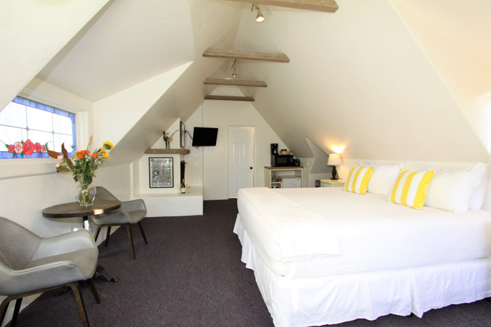 carmel lodging - small bed tucked into eves of upper story